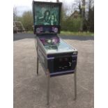 A 80s Cottlieb Premier Genesis pinball machine, with angled gaming board under glass