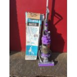 A Dyson ball telescopic reach vacuum cleaner, complete with attachments; and a boxed Bex-Bissell