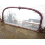 A large Victorian mahogany sideboard mirror, the arched moulded frame with scrolled carving.