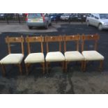 A set of five Victorian aesthetic oak dining chairs