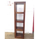 A hardwood shelf unit with four square platforms.