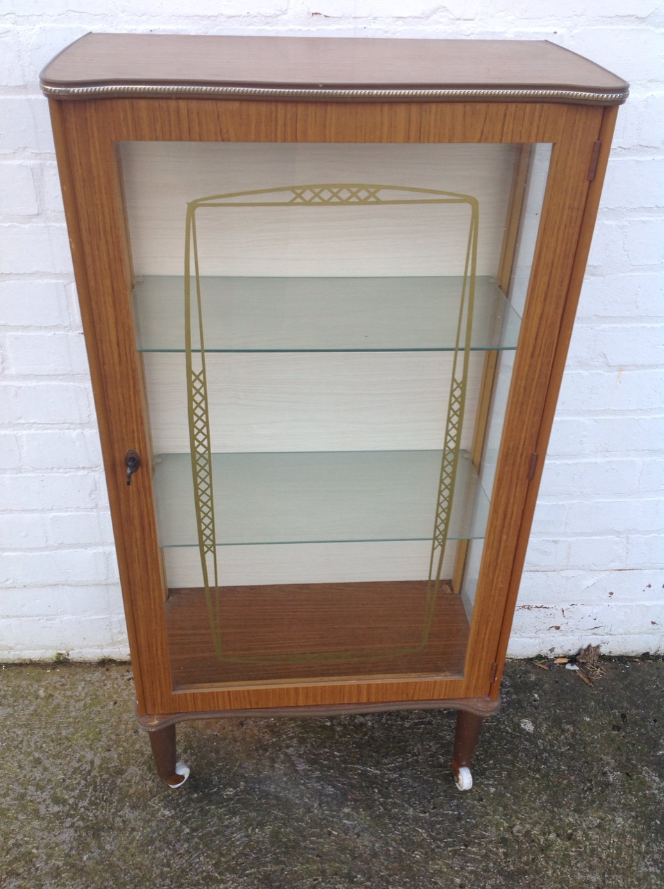 A 60s faux walnut cabinet