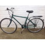 A Raleigh Pioneer bicycle with gel seat, Shimano gears, mudguards, luggage rack, etc.