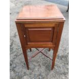 An Edwardian mahogany pot cupboard with square moulded top above a fielded panelled door