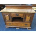 An art nouveau walnut sideboard, with rectangular moulded top above a central single drawer