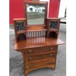 An arts & crafts mahogany dressing table