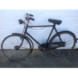 A Raleigh All-Steel gents bicycle with gears, dynamo powered lights, canvas sprung seat, mudguards,