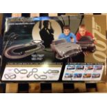 A boxed Scalextric 007 set with James Bond track, cars, controls, instructions, etc. (A lot)