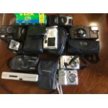 A quantity of cameras - Nikon, Kodak, a flash, Olympus, Halina, Pentax, films, some cased, etc;