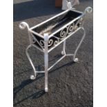 A wrought iron planter