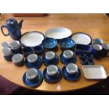 A collection of blue glazed Denby including dishes, plates, bowls, ramekins, cups & saucers