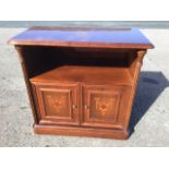 A mahogany side cabinet with rectangular moulded and rounded top