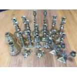 Eleven pairs of brass candlesticks, some nineteenth century baluster, twisted, ribbed