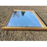 A contemporary gilt framed mirror with bevelled plate