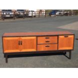 A 60s G-plan teak sideboard with ebonised trim