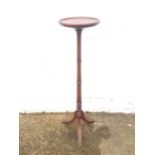 A mahogany jardinere stand, with circular tray top on ring-turned column with tripod feet.