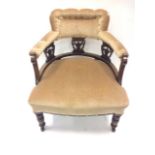 A late Victorian captains chair with button upholstered back & arms