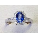 An 18ct white gold sapphire & diamond cluster ring