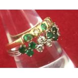 Two 18 carat gold emerald & diamond rings, one bezel set with alternating stones as a half-eternity