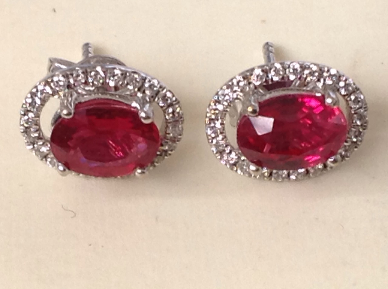 A pair of ruby and diamond cluster earrings, the claw set oval rubies of over two carats - Image 3 of 3