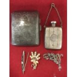 A hallmarked silver cigarette case with foliate scrolled decoration