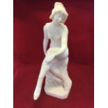 E Battaglia, an Italian carved marble figure of 30s girl in bathing suit, seated on naturalistic