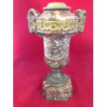 A rouge marble tablelamp having ormolu mounts, the urn shaped column with pierced swagged floral