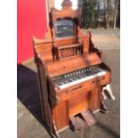 A Victorian American walnut cased organ by The Cable Company of Chicago.