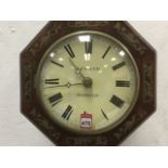 A Victorian octagonol rosewood cased wallclock by J Faller of Norwich, the signed dial with roman