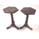 A pair of nineteenth century hexagonal candlestands, the chinoiserie stencilled moulded tops