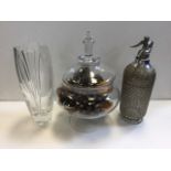 An Atlantis tall cut glass vase with etched decoration; a glass soda syphon with wirework to body,