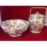 A Maling brown chintz biscuit barrel & cover with cane handle; and a matching Chelsea