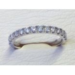 An 18ct brilliant cut diamond eternity ring, the diamonds of approx half a carat, the stones set