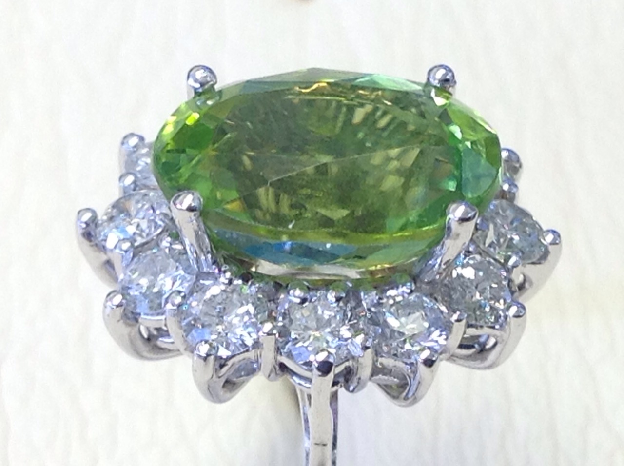 An 18ct diamond and peridot cluster ring, the large green oval stone of over four carats - Image 2 of 3