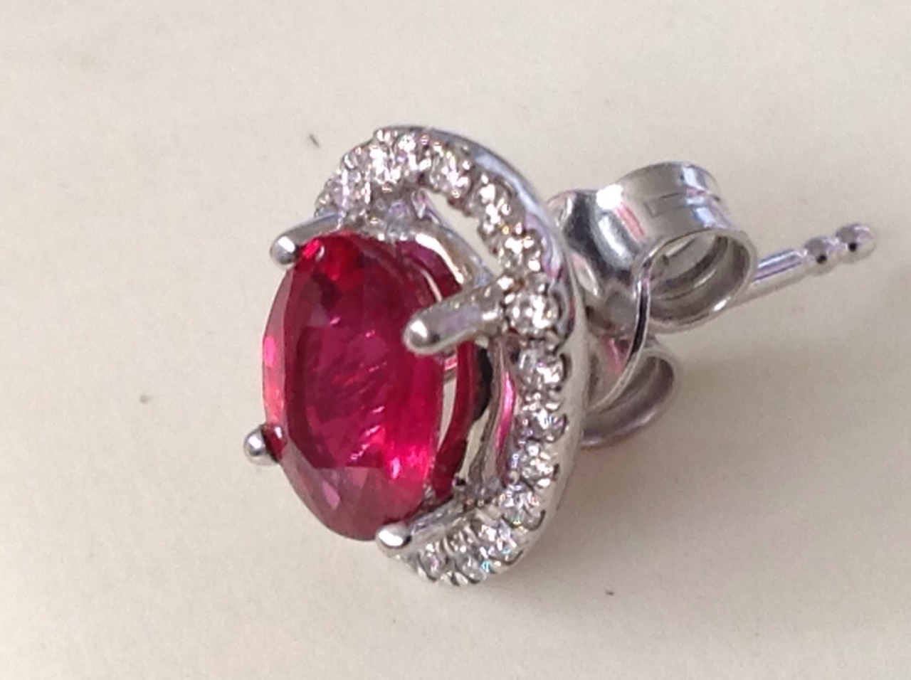 A pair of ruby and diamond cluster earrings, the claw set oval rubies of over two carats - Image 2 of 3