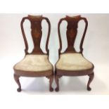A pair of George II walnut chairs