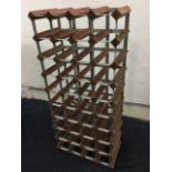 A wood wine rack by Farrow & Jackson, London, the compartments to hold forty bottles.