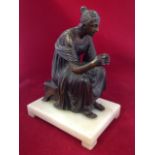 Nineteenth century bronze, seated lady with flowers, raised on rectangular marble plinth. (9.5in)