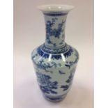 A large nineteenth century Chinese blue & white vase, the waisted neck with blossom decoration