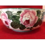 A Wemyss fruitbowl painted with frieze of roses and green leaves, framed by green line to foot & rim