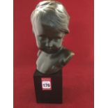 J Doiunis, bronzed bust of a young child, signed & numbered, mounted on marble plinth. (10.75in)