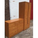 An Alstons bedroom chest and wardrobe, the seven drawer cabinet with brass loop handles, the robe