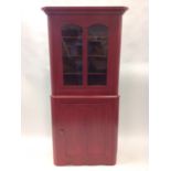 A Victorian painted pine corner cupboard, the top with moulded cornice above double arched glazed