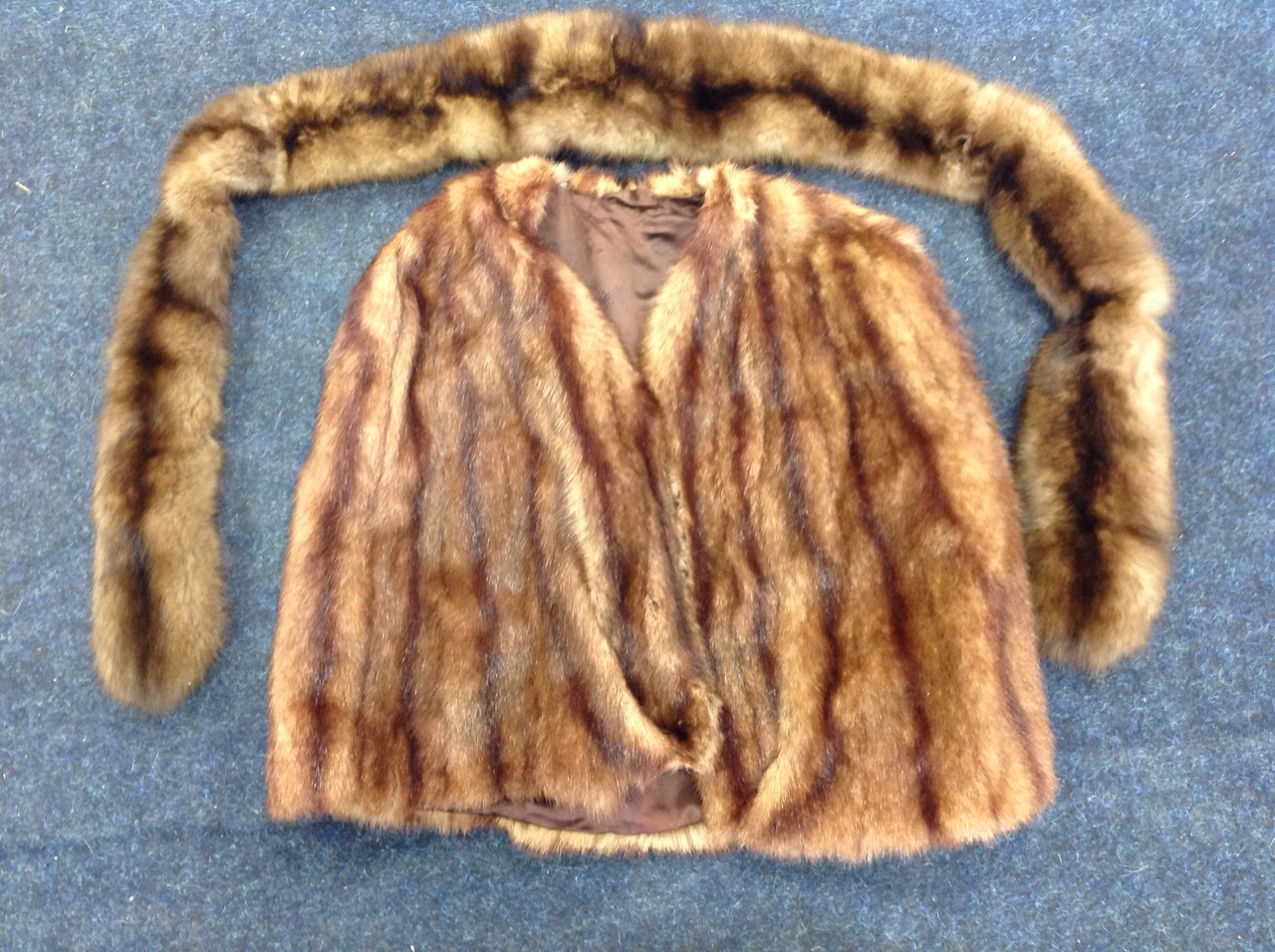 A lined mink fur cape; and a long mink scarf. (2)