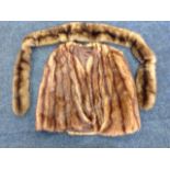 A lined mink fur cape; and a long mink scarf. (2)