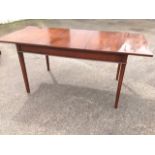 A Rackstraw mahogany draw-leaf dining table, the crossbanded top with scalloped ends supported on