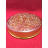 A French Verlys amber glass circular bowl & cover, the lid heavily embossed with spray of flowers on