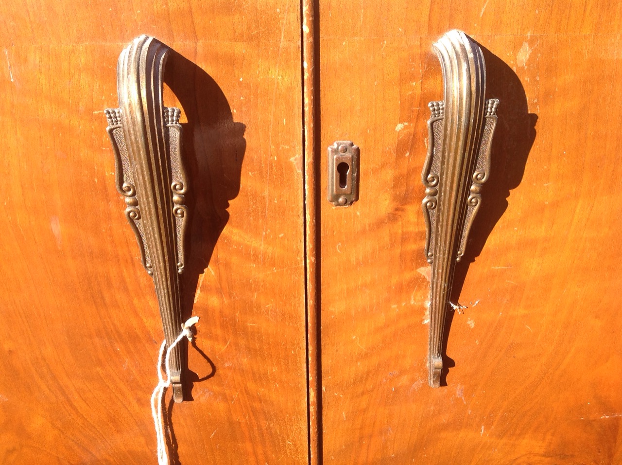 A 50s walnut wardrobe/compactum, with shaped crossbanded doors enclosing an interior with hanging - Image 3 of 3