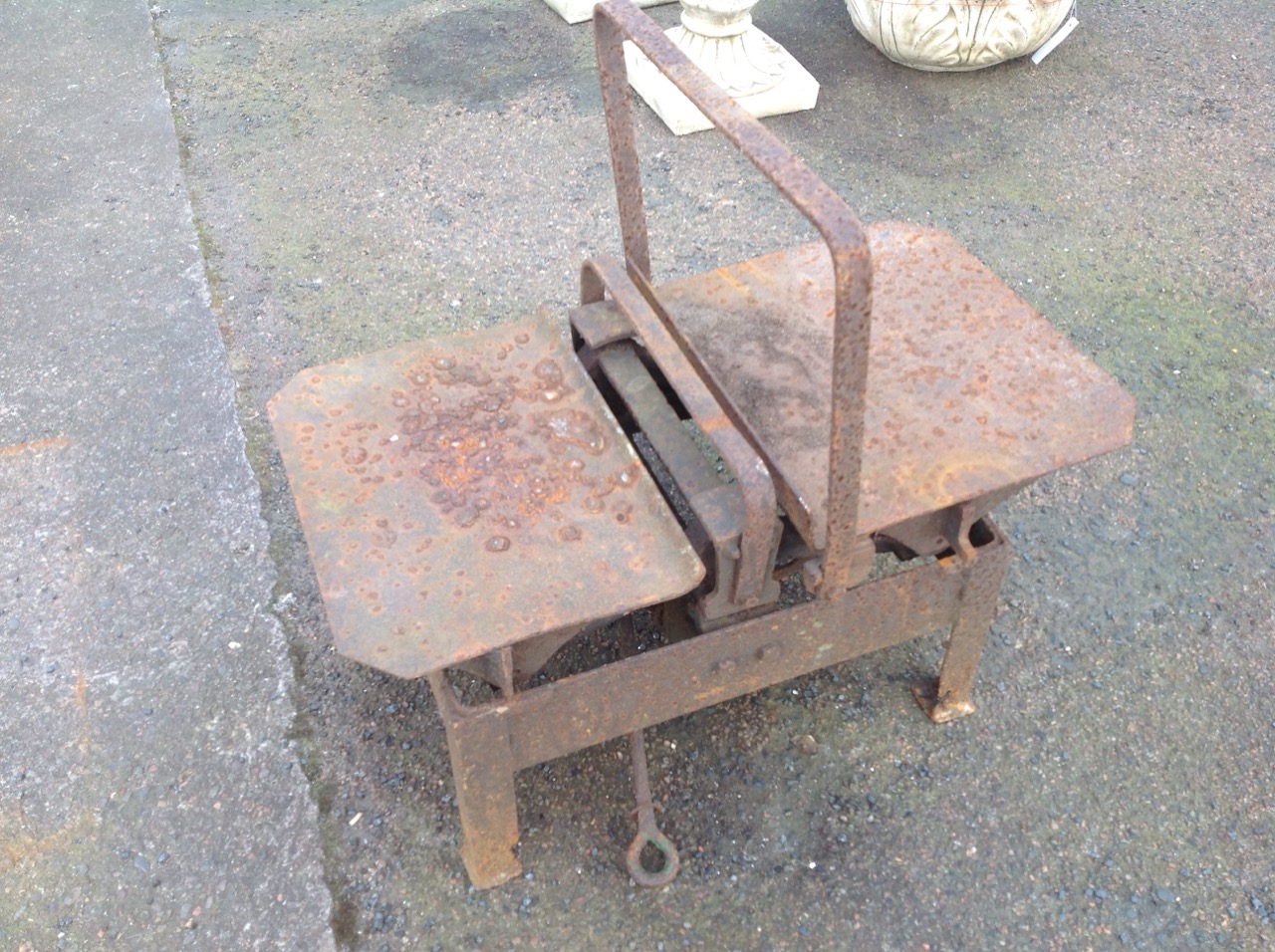 A set of Victorian sack scales, with two weighing platforms on rectangular iron base.