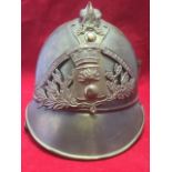 A French brass military helmet, the badge with banner reading Sapeurs Pompiers de Bouafle, with
